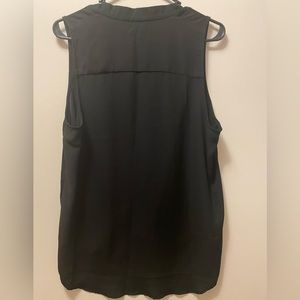 Women’s sleeveless blouse with inverted pleat